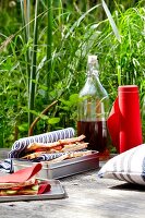 Sandwiches and drinks on table at picnic