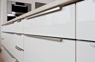 Close-up of kitchen with white cabinets