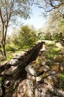 Stone fence of Santa Cristina sacred well in Paulilatino, Oristano, Sardinia, Italy