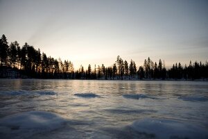 View of frozen landscape of Lapland at sunset, Finland