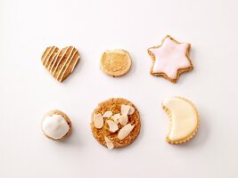 Various shapes of Christmas cookies on white background