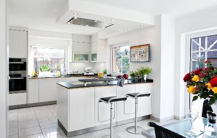 Kitchen in white with eating area