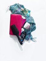 Handbag, brush, scarf, cosmetics and pouch on white background, overhead view