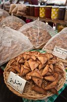 Baskets of snacks covered with net in Souk El Tayeb organic market, Beirut, Lebanon