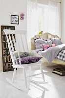 Bedroom with wooden bed & rocking chair