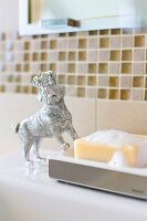 Bathroom soap with decoration of dog with crown