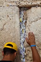Rear view of man praying on Wailing Wall, Jerusalem, Israel