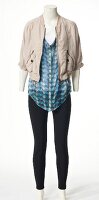 Beige jacket with long blouse and pants on mannequin