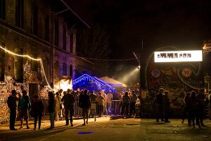 People standing at the entrance of night club in Friedrichshain, Berlin, Germany