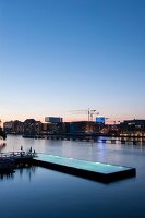 View of bathing ship pool on Spree river at dusk, Wrangelkiez, Berlin, Germany