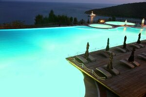 Man swimming in pool of Kempinski Hotel Barbaros Bay in Aegean, Turkey