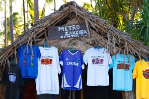 T-shirts hanging on roof of shop in Zanzibar, Tanzania, East Africa