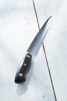 Carving knife on wooden floor