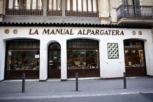 Exterior of La Manual Alpargatera and street in Barcelona, Spain
