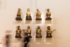 Busts of saints of Freiburg guilds in Augustiner Museum, Freiburg, Germany, blurred motion