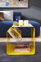 Yellow side table with magazine rack
