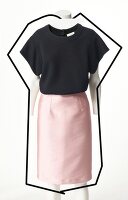 Black top and pink silk mix skirt on mannequin against white background