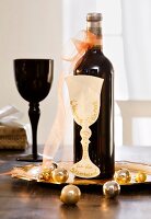 Wine glass shaped card voucher with wine bottle on tray