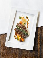 Grilled Wagyu beef shoulder with carrots and onions