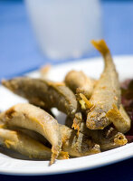 Fried fish on a white plate