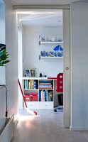 Desk with shelves and red chair