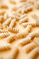 Gluten Free Spiral Rice Pasta on Wooden Surface