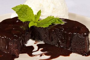 Warm Chocolate Cake with Vanilla Ice Cream and a Mint Garnish