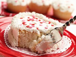 Partially Eaten with Fork Mini Heart Shaped Cake with White Frosting and Pink red and White Candy Hearts