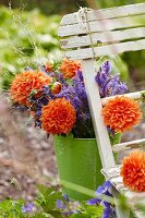 A bunch of summer flowers on a garden chair