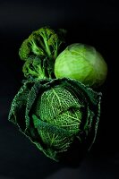 An arrangement of savoy cabbage, white cabbage and broccoli