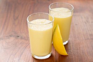 Two glasses of mango lassi