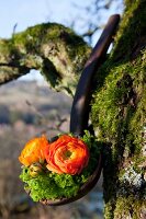 Flower arrangement of ranunculus and moss