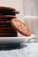 Molasses Cookies on a Plate; Glass of Milk