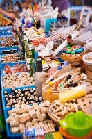 Kitchen utensils on a market stand