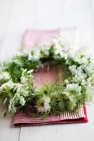 Wreath made of nigella, cow parsley, campion and soft-pink mini carnations