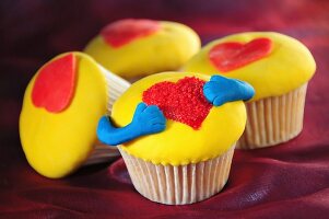 Yellow cupcakes decorated with hearts