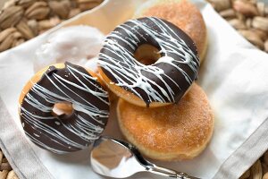 Sugared doughnuts and ring doughnuts with chocolate glaze