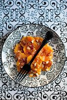 Orange and apricot salad with hazelnuts and maple syrup