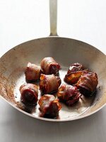Dates Wrapped in Bacon in a Wok