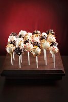 Assorted Cake Pops on a Wooden Stand