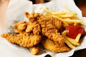 Chicken goujons with chips and ketchup