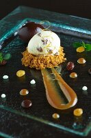 A quenelle of quark with rum-soaked raisins on crumble