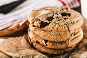 Stacked chocolate chip cookies on a table