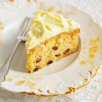 A slice of lemon cake with raisins