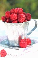 Raspberries in a zinc cup