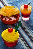 A Tequila Sunrise cupcake and cocktail