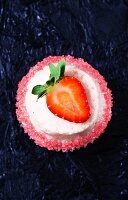 Daiquiri cupcake decorated with a strawberry and a sugared edge