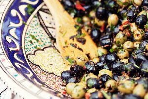 Marinated green and black olives