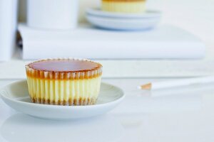 A cheesecake cupcake with an apricot glaze