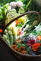 A basket of fresh organic vegetables and flowers